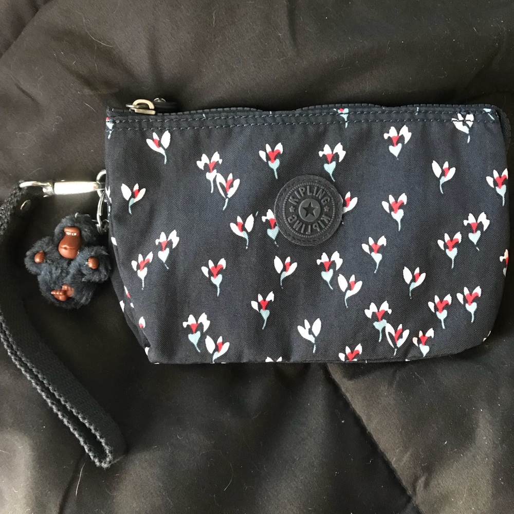 KIPLING Extra large wristlet. Floral pattern